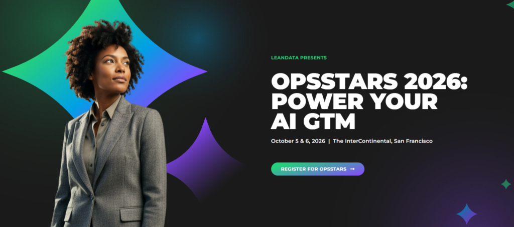 Banner for OpsStars 2026-arrangementet fra LeanData med en profesjonell kvinne, mørk gradientbakgrunn, overskriften «Power Your AI GTM», datoene 5.–6. oktober 2026 og informasjon om stedet i San Francisco